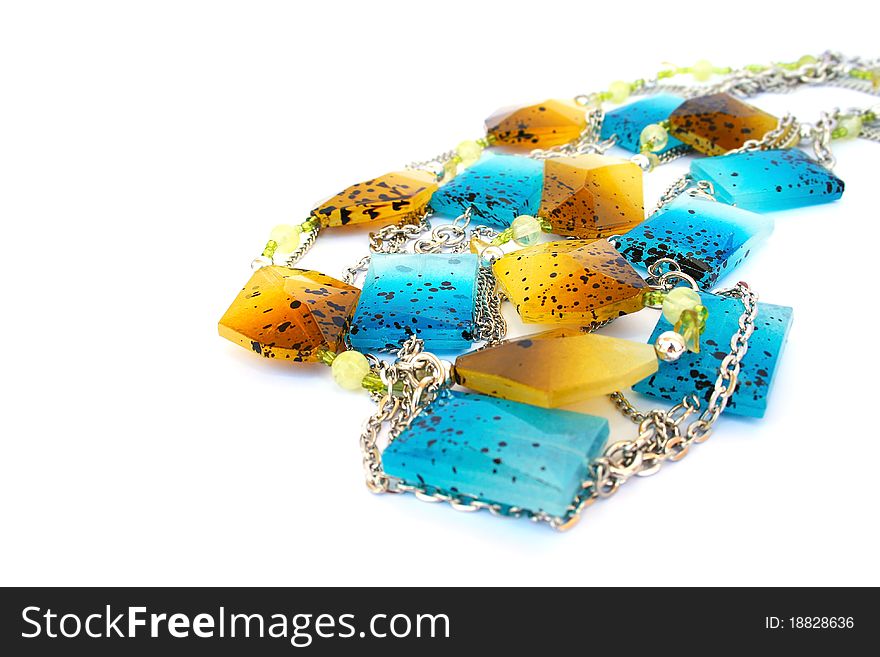 Blue and yellow necklaces isolated on white background.