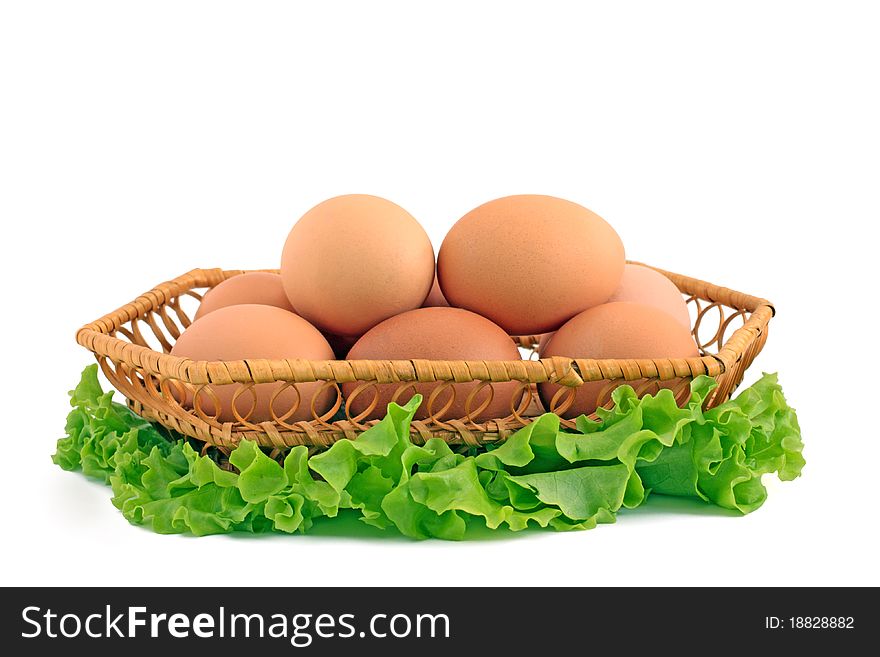 Eggs in a basket a over white background