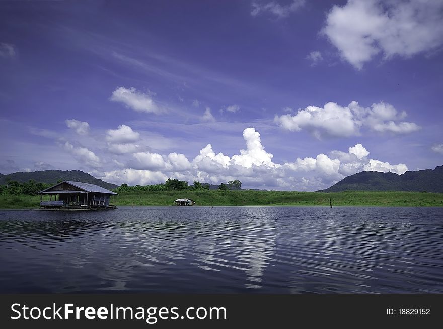 A raft is in a dam in thailand. A raft is in a dam in thailand