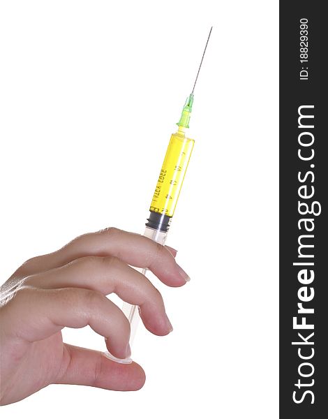 Hand holding syringe withe yellow content against white background. Hand holding syringe withe yellow content against white background