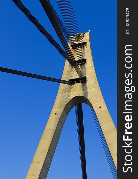 Suspension bridge with cables reaching to the deck of the bridge from the columns