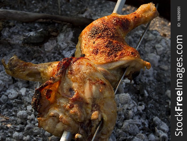 Chicken leg broiled on fire
