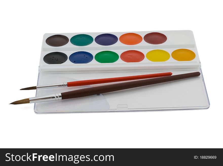 Watercolor paints and brushes are isolated on a white background. Watercolor paints and brushes are isolated on a white background