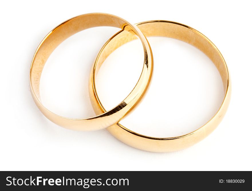 Two gold rings on white background