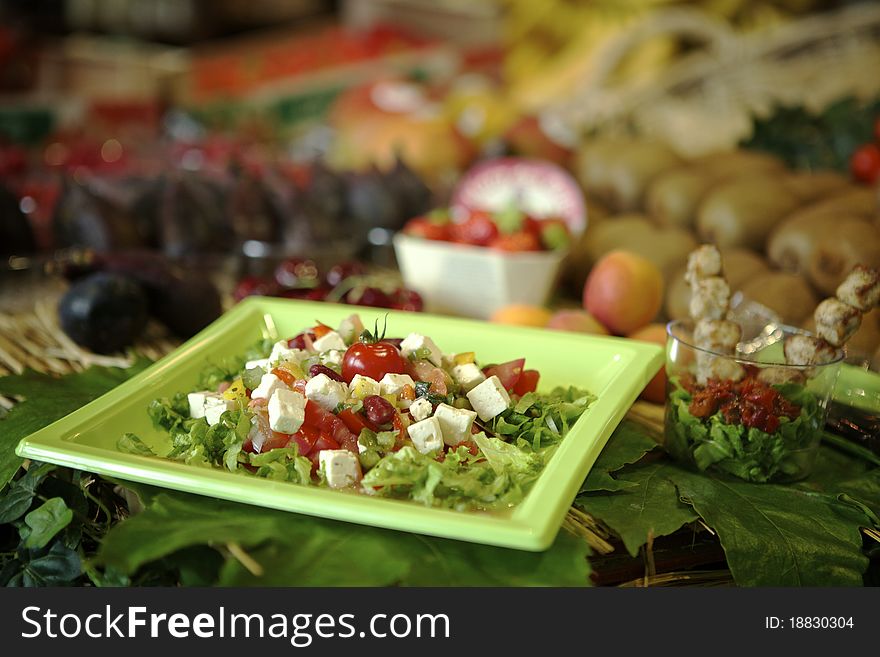 Fresh greek salad on a market in a plastic dish