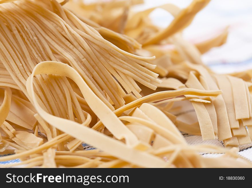 Close-up view of fresh homemade noodles. Close-up view of fresh homemade noodles.