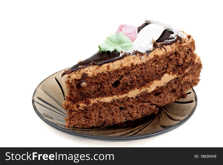 Piece of cake on a plate isolated on a white background