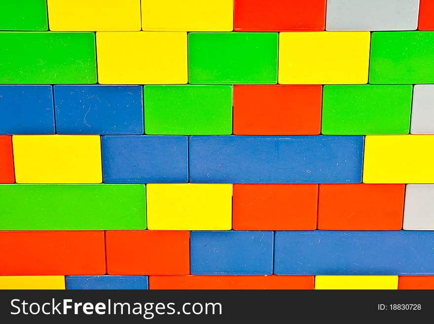 Background of plastic building blocks. Bright colors. Background of plastic building blocks. Bright colors.