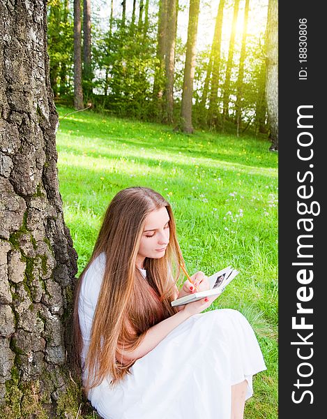 Beautiful Young Girl Writing Outdoor. Beautiful Young Girl Writing Outdoor