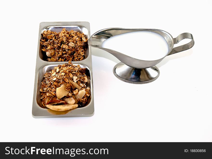 Muesli and milk isolated on white background. Muesli and milk isolated on white background.