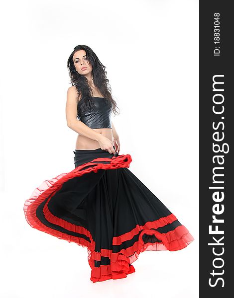 Studio portrait of young attractive woman dancing flamenco