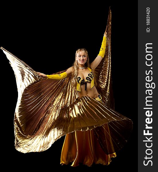 Beauty blond mature woman dance with gold wing arabian style. Beauty blond mature woman dance with gold wing arabian style