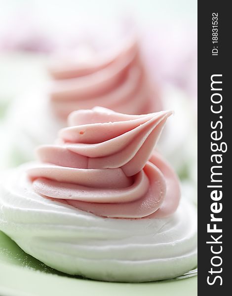 Meringue nests topped with strawberry cream. Meringue nests topped with strawberry cream