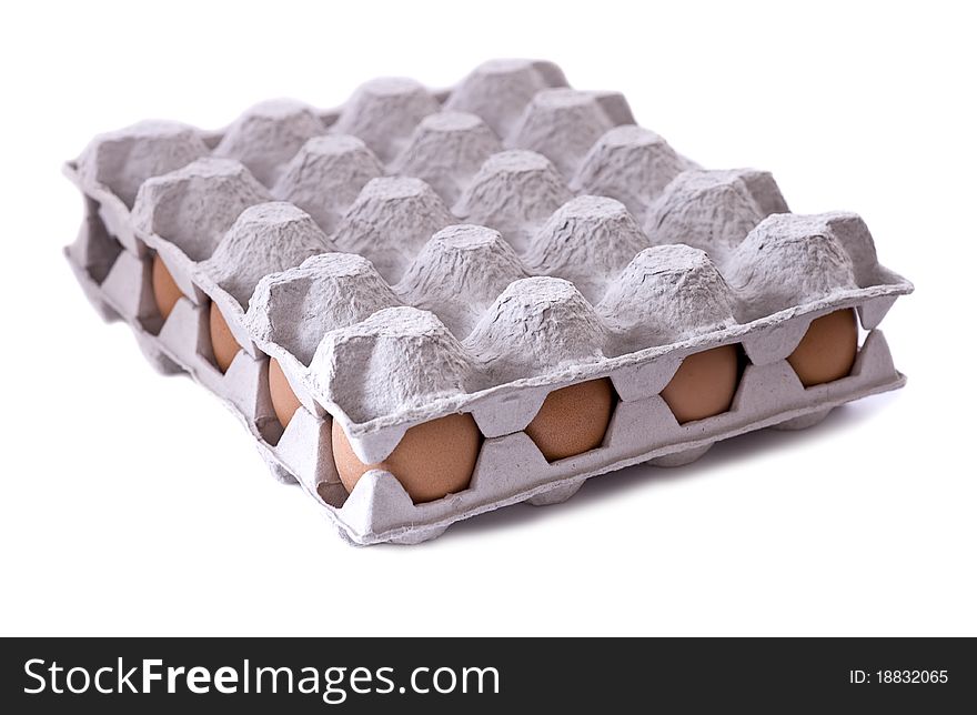 Eggs in carton on white background
