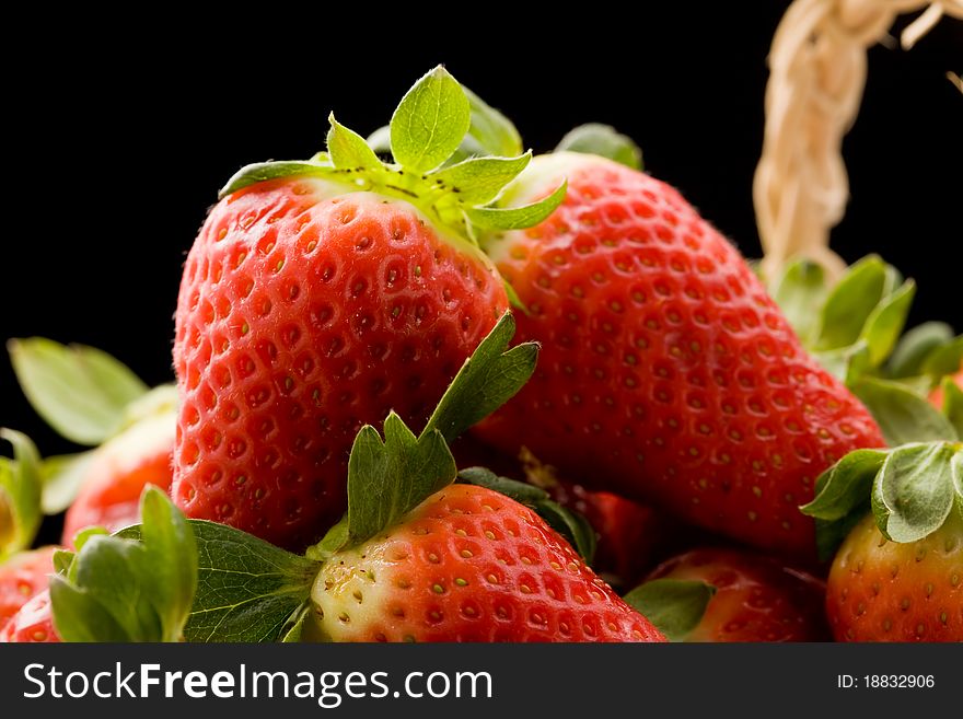 Photo of delicious red strawberries inside a basket