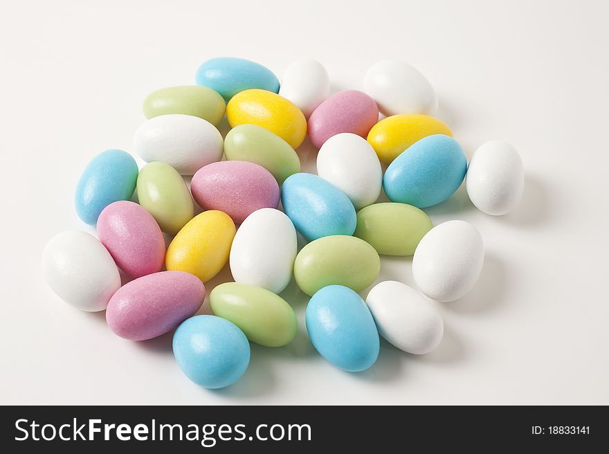 Colorful Easter almonds on white background. Colorful Easter almonds on white background