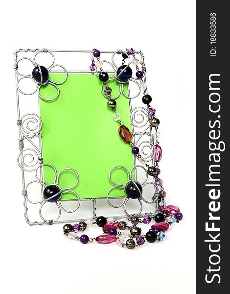 Wire picture frame with purple beads and green key center. Wire picture frame with purple beads and green key center