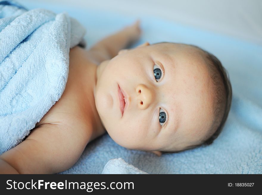 Three month old baby boy with blue eyes. Three month old baby boy with blue eyes