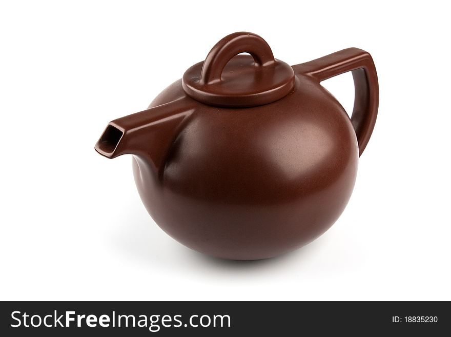 Brown ceramic teapot isolated on white background