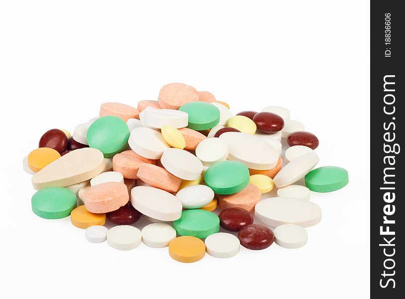 Medicines, tablets of different colors on a white background for your design