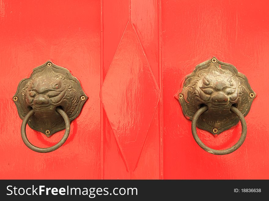 Oriental door knob on red background