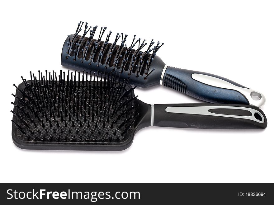 Two hairbrushes isolated on a white background