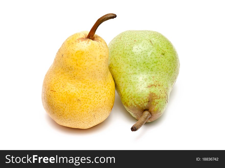 Green and yellow pear over white background