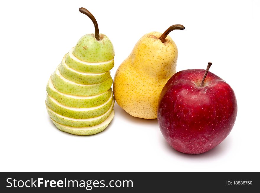 Green slliced pear, yellow pear and a red apple. Green slliced pear, yellow pear and a red apple