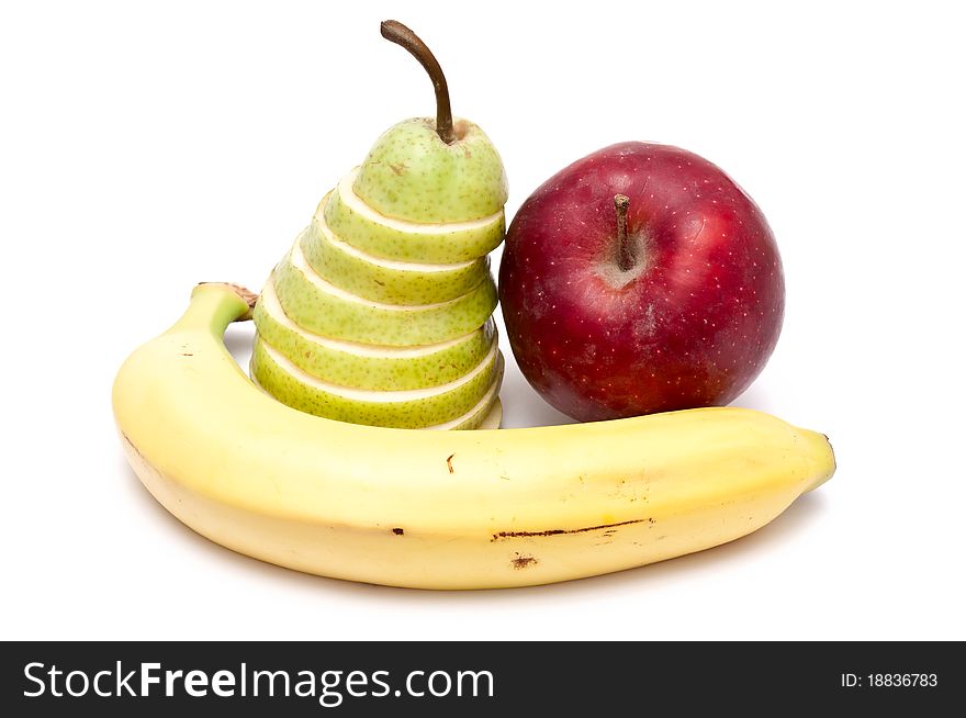 Sliced green pear, red apple and a banana. Sliced green pear, red apple and a banana