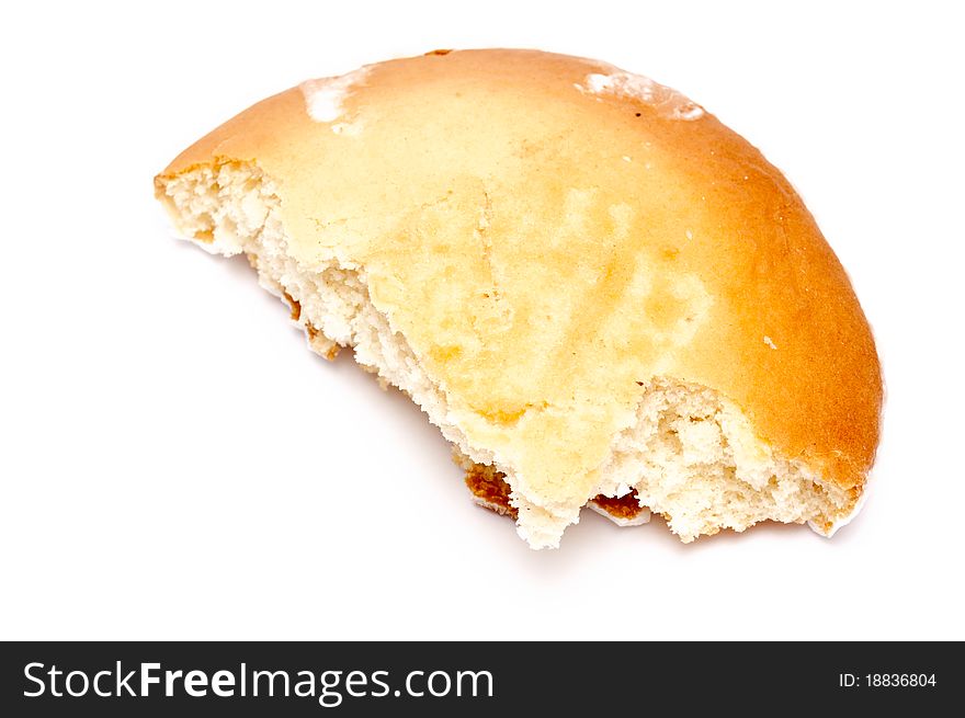 Single biten pastry over a white background