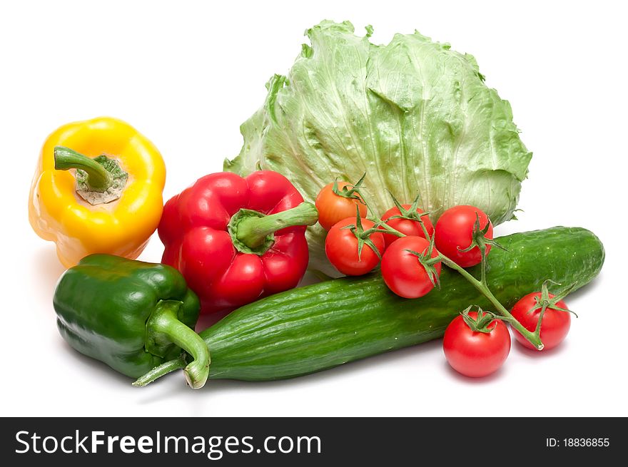 Paprika,cucumber,tomatoes and salad over white background. Paprika,cucumber,tomatoes and salad over white background