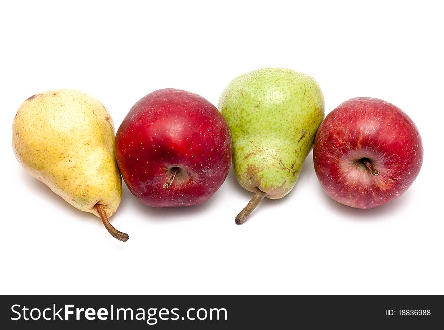 Red apples, yellow and green pears over white background