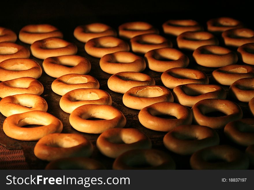 Donuts are baking in the hot oven. Donuts are baking in the hot oven