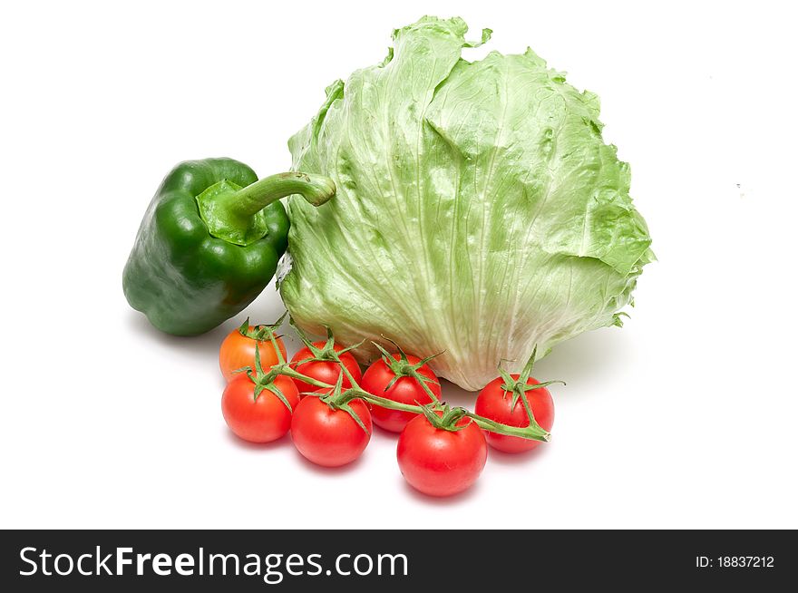 Paprika,tomatoes and salad over white background. Paprika,tomatoes and salad over white background