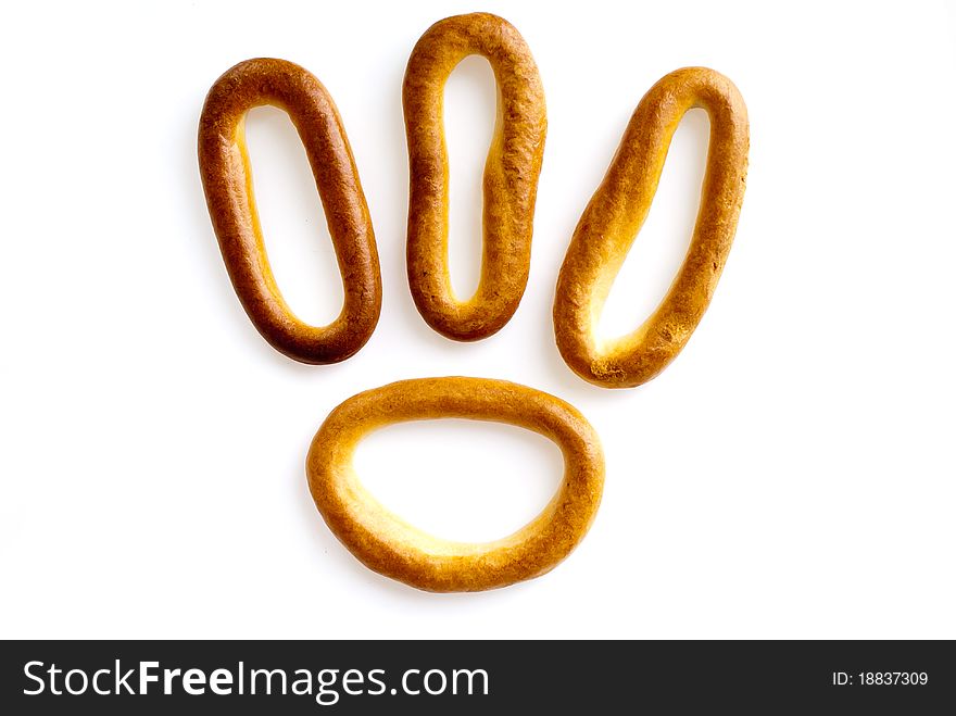 Meal theme. Nice bagels on a white background, look like appetizing. Meal theme. Nice bagels on a white background, look like appetizing.