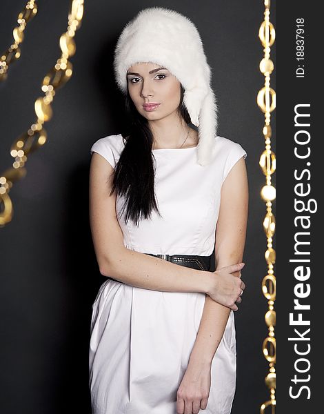 The beautiful women in a white fur hat