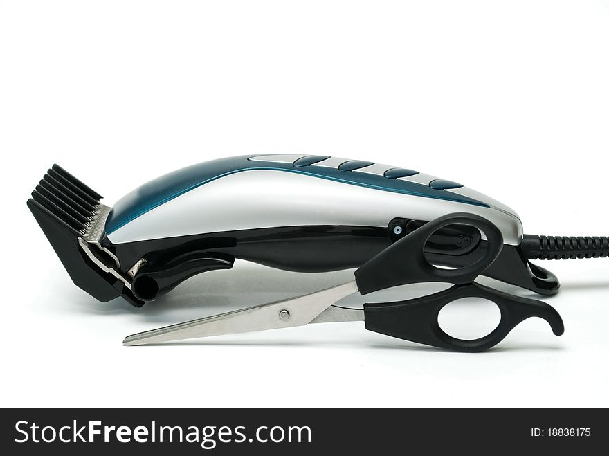 Electric hair clipper with an attachment on a white background. Electric hair clipper with an attachment on a white background