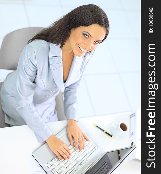 Businesswoman working with laptop at office