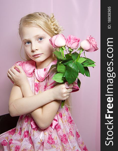 Portrait of a beautiful girl with a rose in his hand