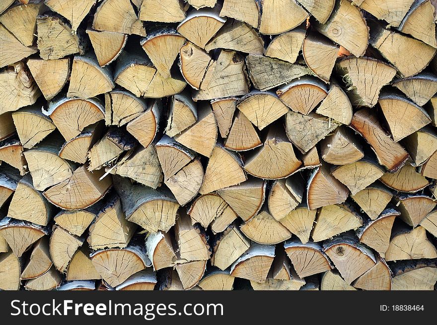 Finely cut firewood , pile of logs
