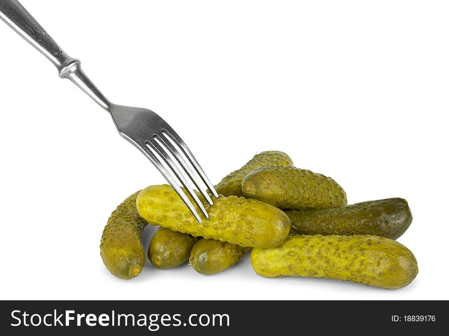 Marinated cornichones and fork  isolated on the white background