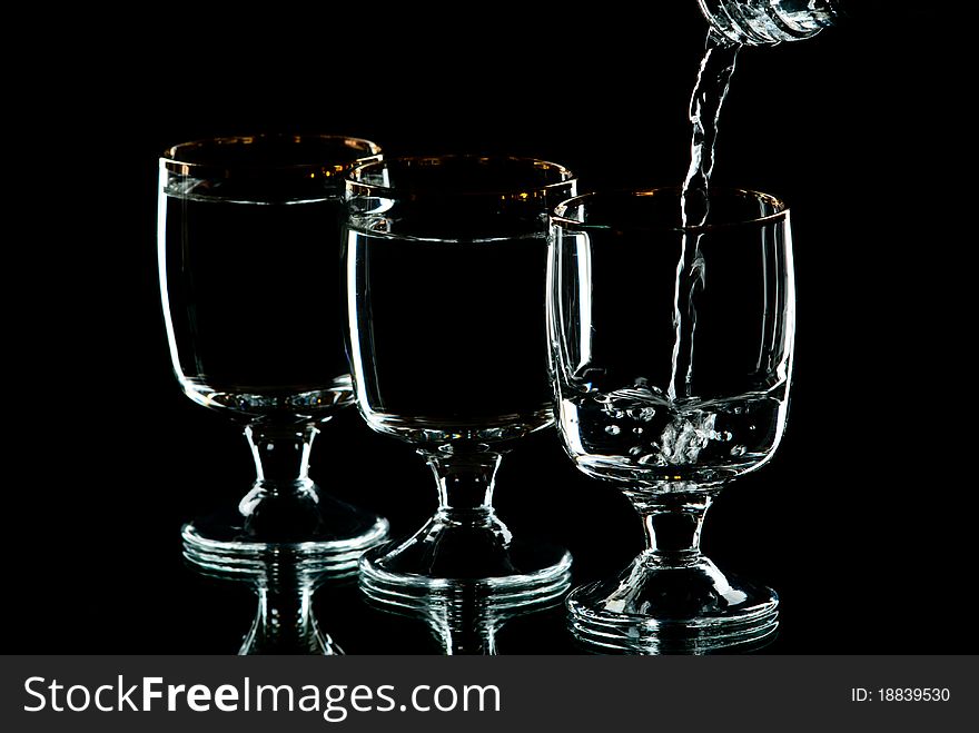 Wine glasses with alcohol. Black Background. Studio shot.