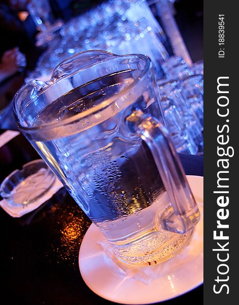 Glasses stacked on a counter in blue light. Glasses stacked on a counter in blue light