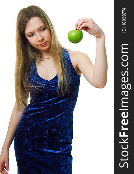 The young beautiful girl in blue dress with a green apple. Isolation on a white background