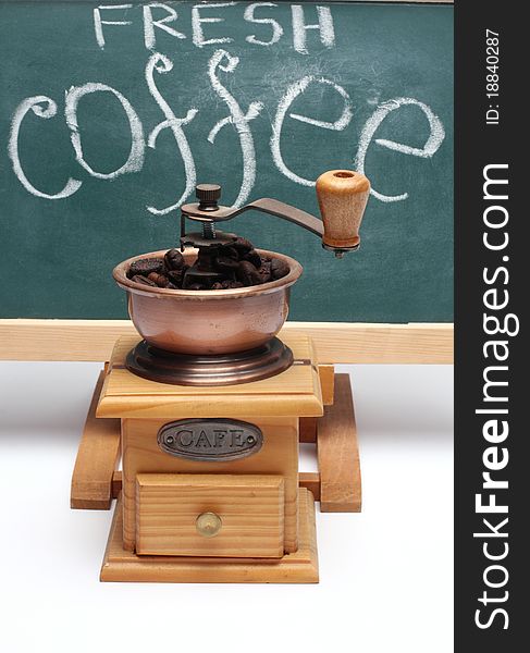 Chalkboard and coffee mill close up