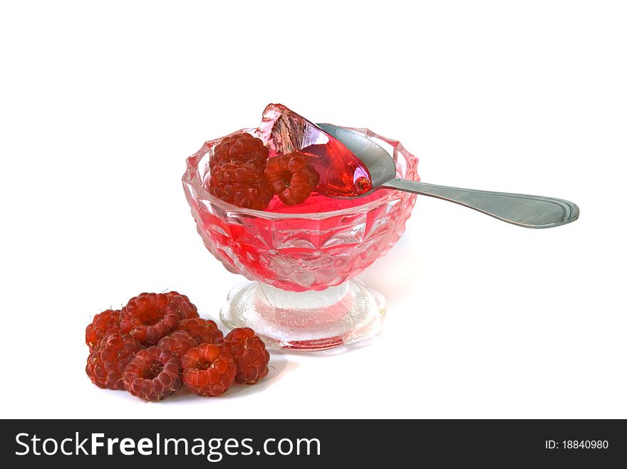 Raspberry jelly in bowl on white background