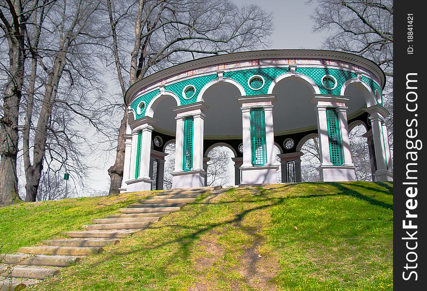 A construction on a green hill with steps to it. A construction on a green hill with steps to it