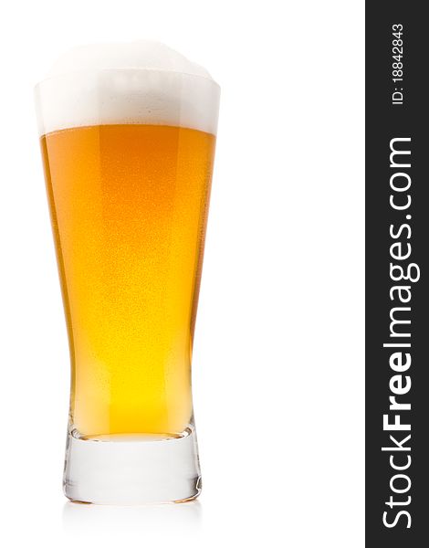 Beer into glass isolated on white. Beer into glass isolated on white