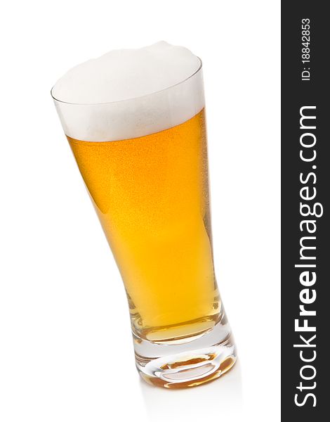 Beer into glass isolated on white. Beer into glass isolated on white