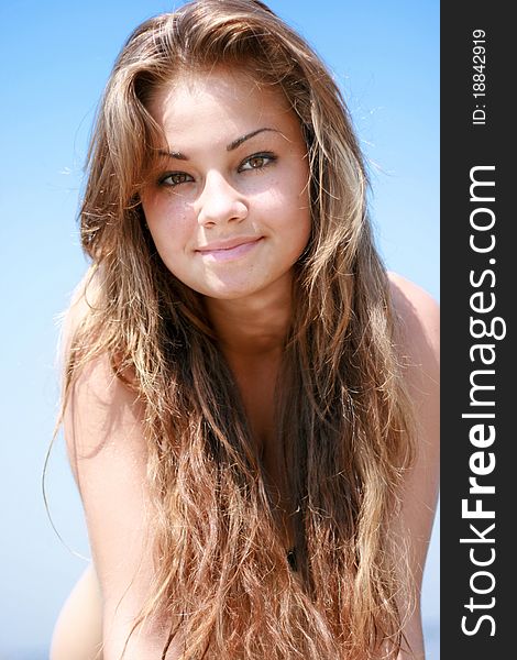 Beautiful young caucasian women portrait against blue sky